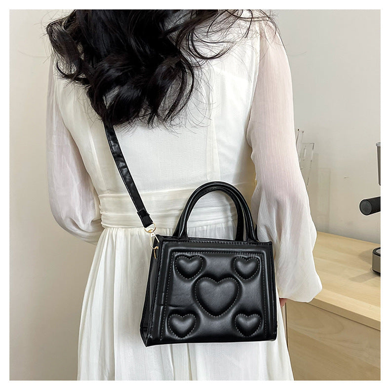 1pc Women’s Stylish Solid Color Handbag with Detachable Strap – Heart Pattern Design, Perfect for Valentine’s Day Gift, Available in Magenta, White, Black, Green, Yellow